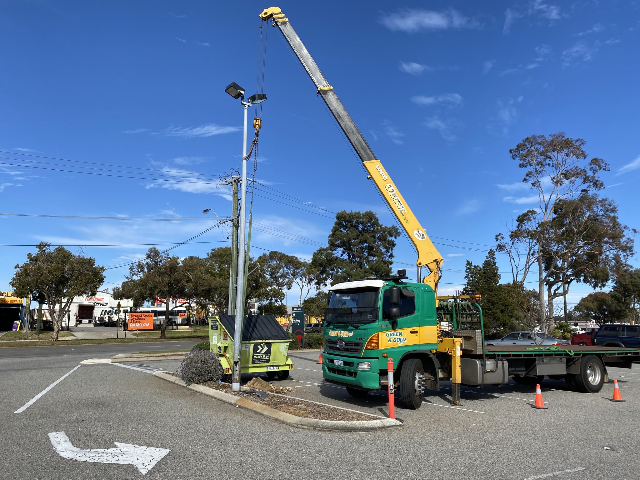PROGRAMMED light pole removal and Install Green and Gold Hiab Hire